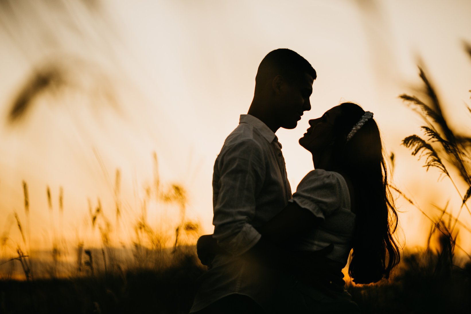 Silhouette of Man and Woman Embracing